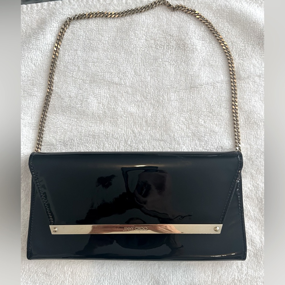 Jimmy Choo Margot Clutch. Black Patent Leather and Gold Hardware.